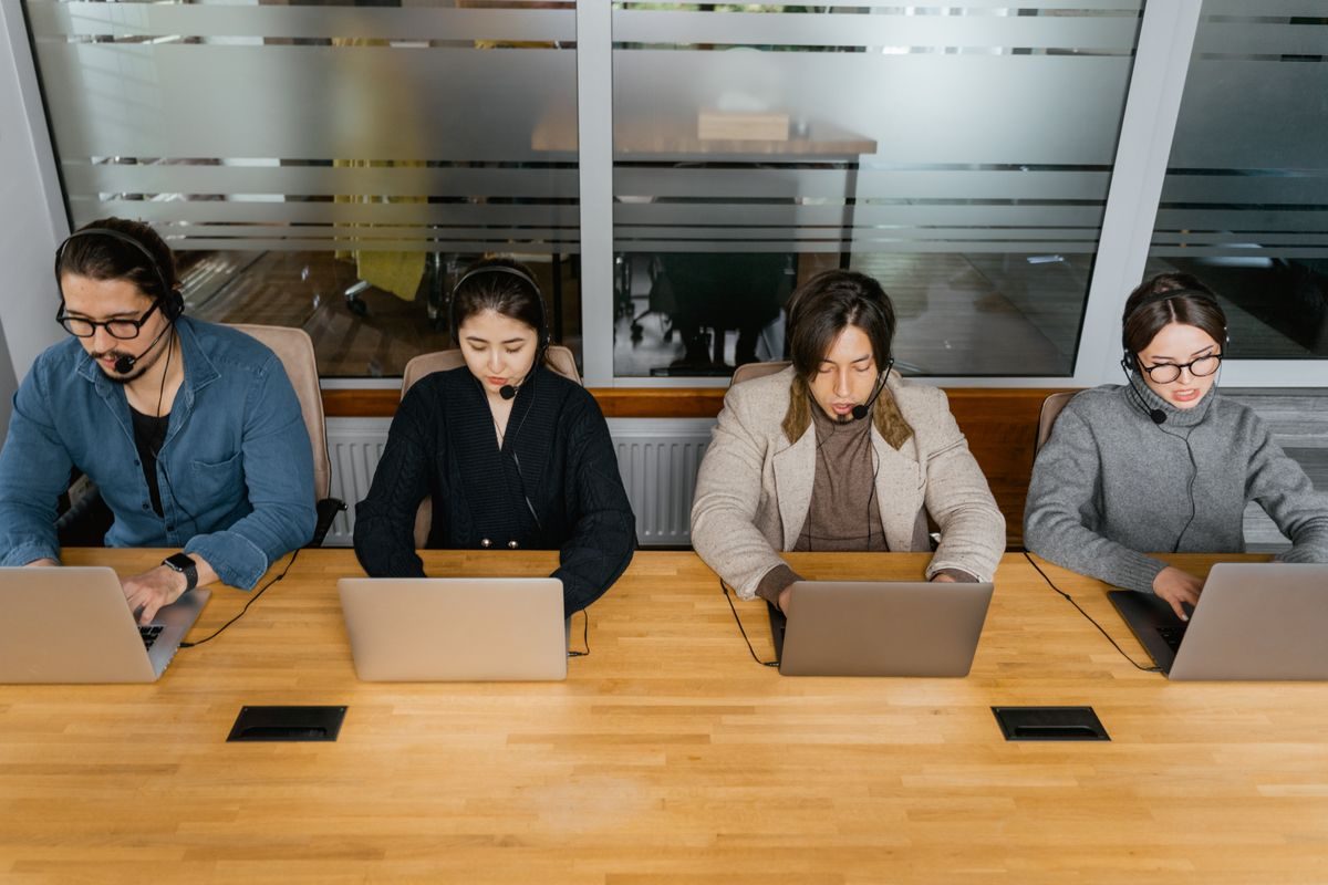 Colleagues discussing work at a table